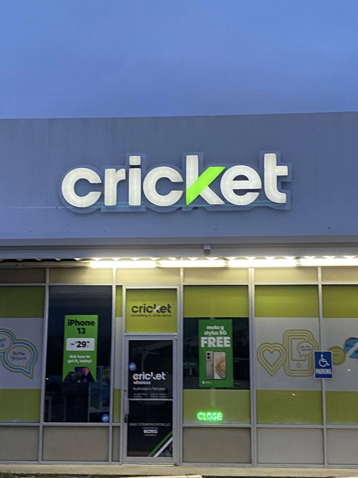 Lighted storefront sign on a retail business in Texas