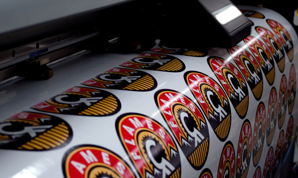 Roll-fed wide format printer running a full colour banner at the Rosenberg TX shop