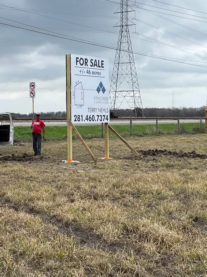 FOR SALE panel on posts in an open field — Intrepid Signs, Rosenberg TX