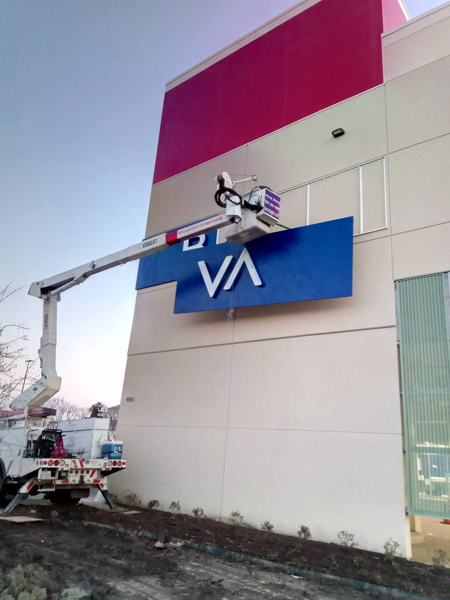 Sign being removed and replaced at a Texas business
