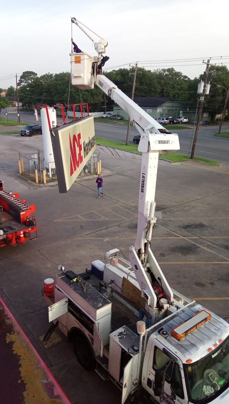 Boom lift working on a pole sign cabinet — Intrepid Signs, Rosenberg TX