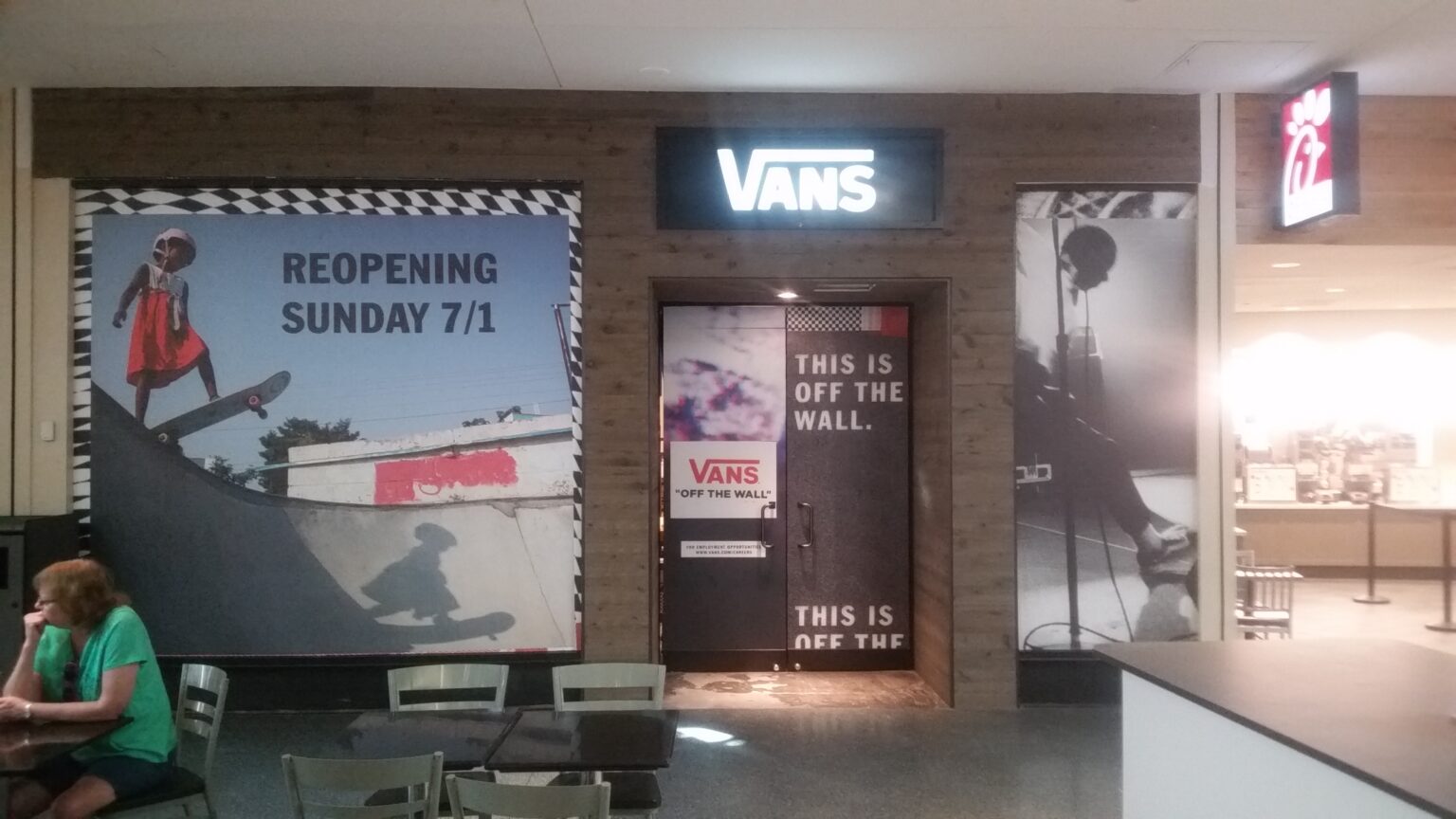 Vans store window decals and reopening graphics during a remodel