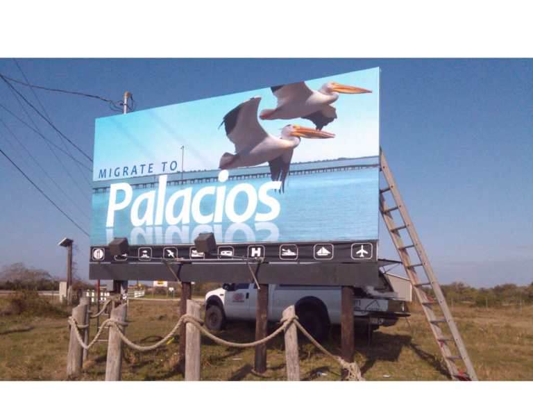 Migrate to Palacios billboard banner on a roadside frame, printed by Intrepid Signs in Rosenberg TX