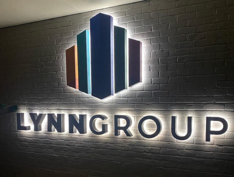 LYNNGROUP illuminated dimensional letters on brick — Intrepid Signs, Rosenberg TX