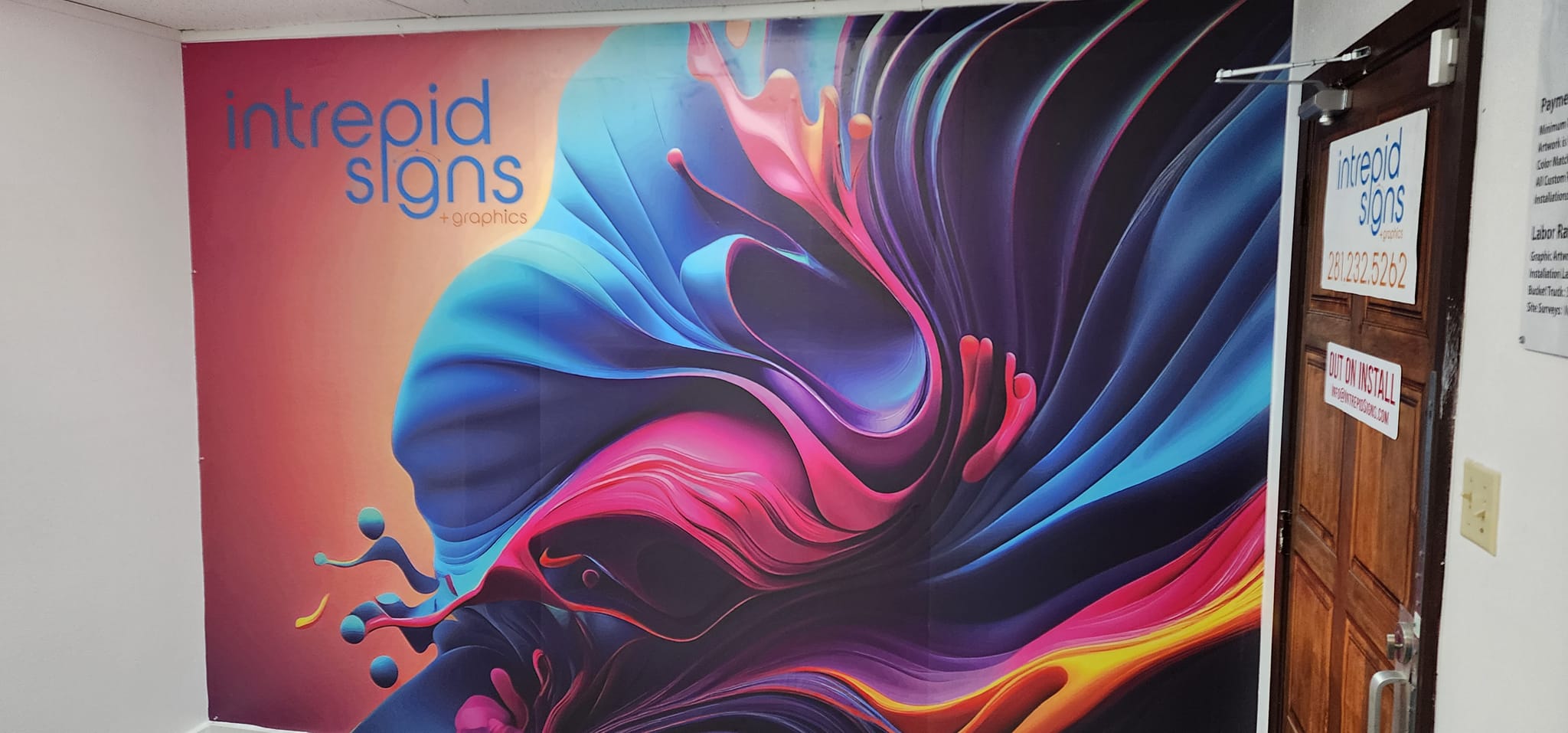 Large format printed wall wrap installed by Intrepid Signs in Rosenberg TX